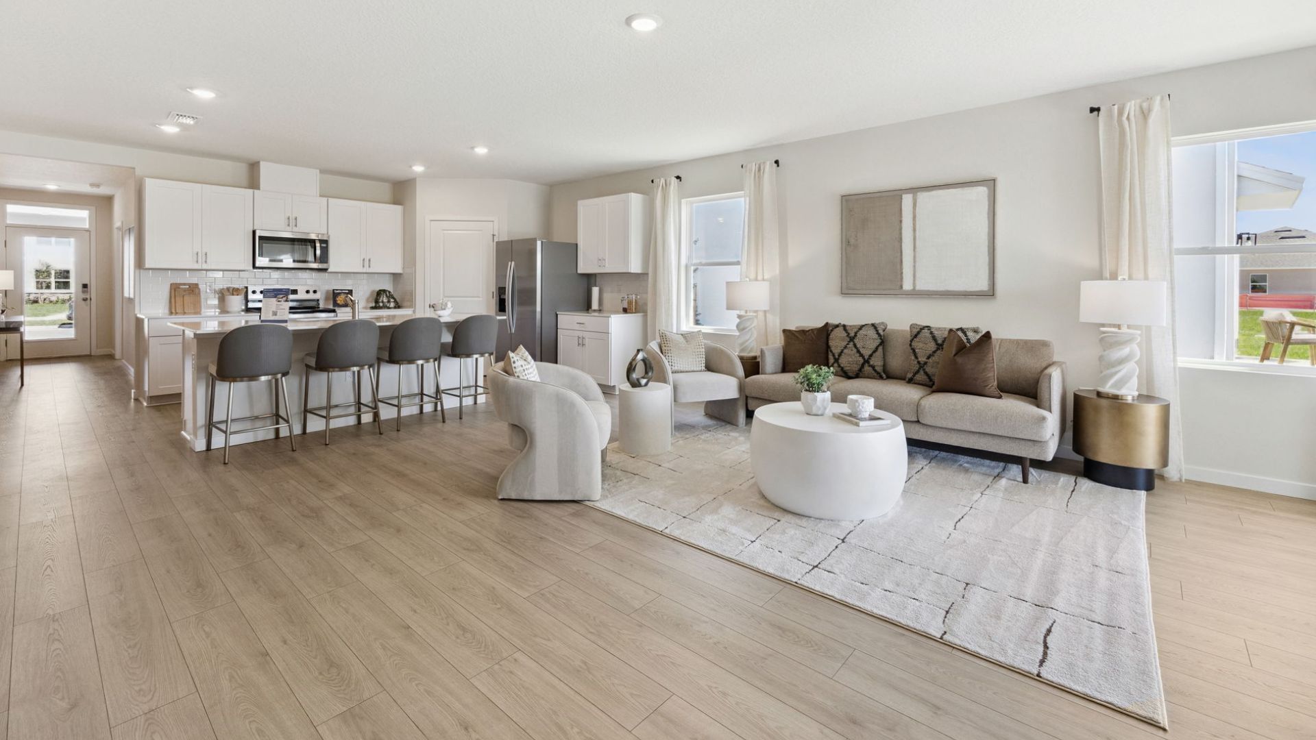Single story new home with large windows and 2 car garage.