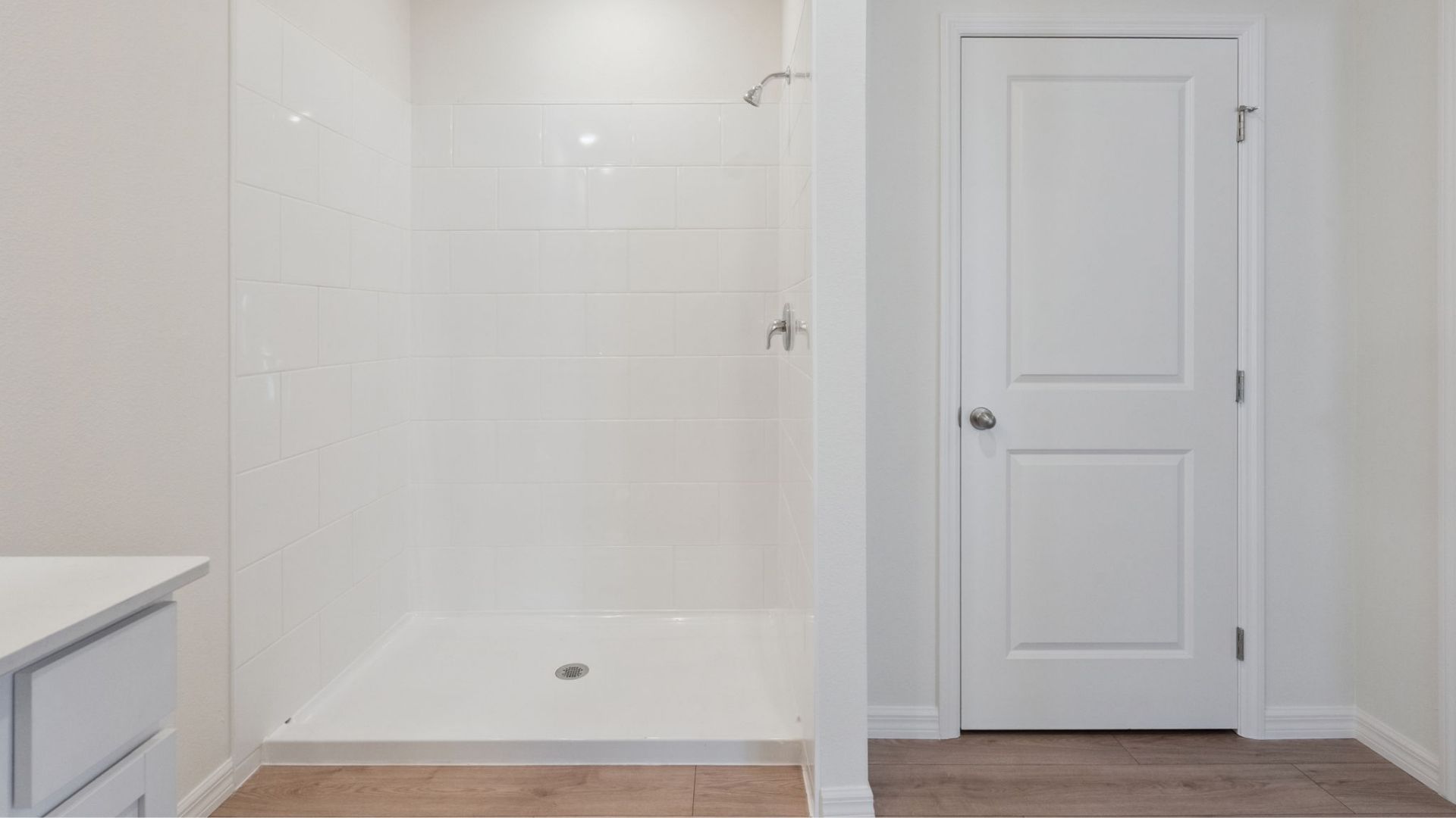 bathroom with quartz counter and laminate flooring