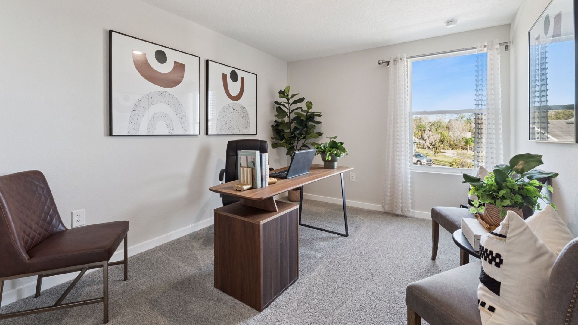 Functional home office with desk, chairs and space to work or play.