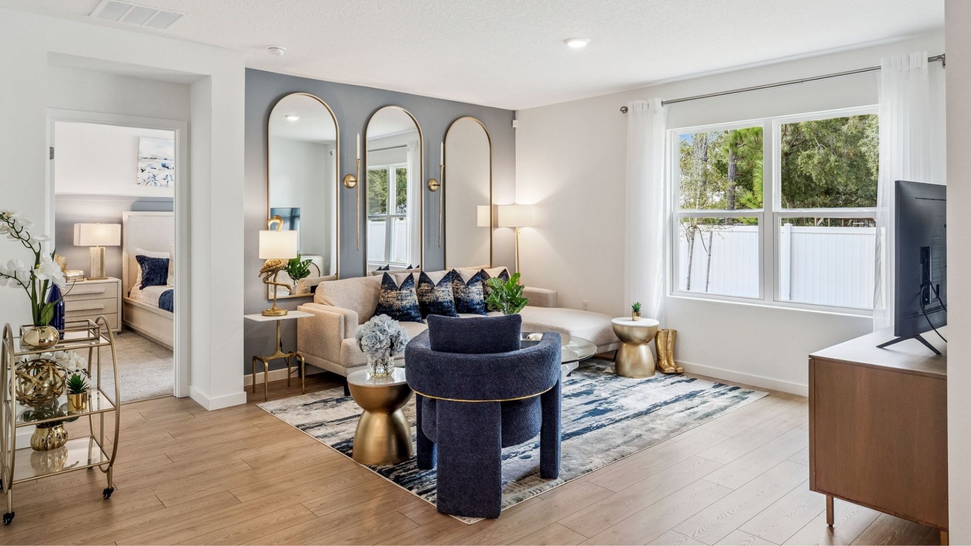 living area with sitting and laminate revwood select flooring