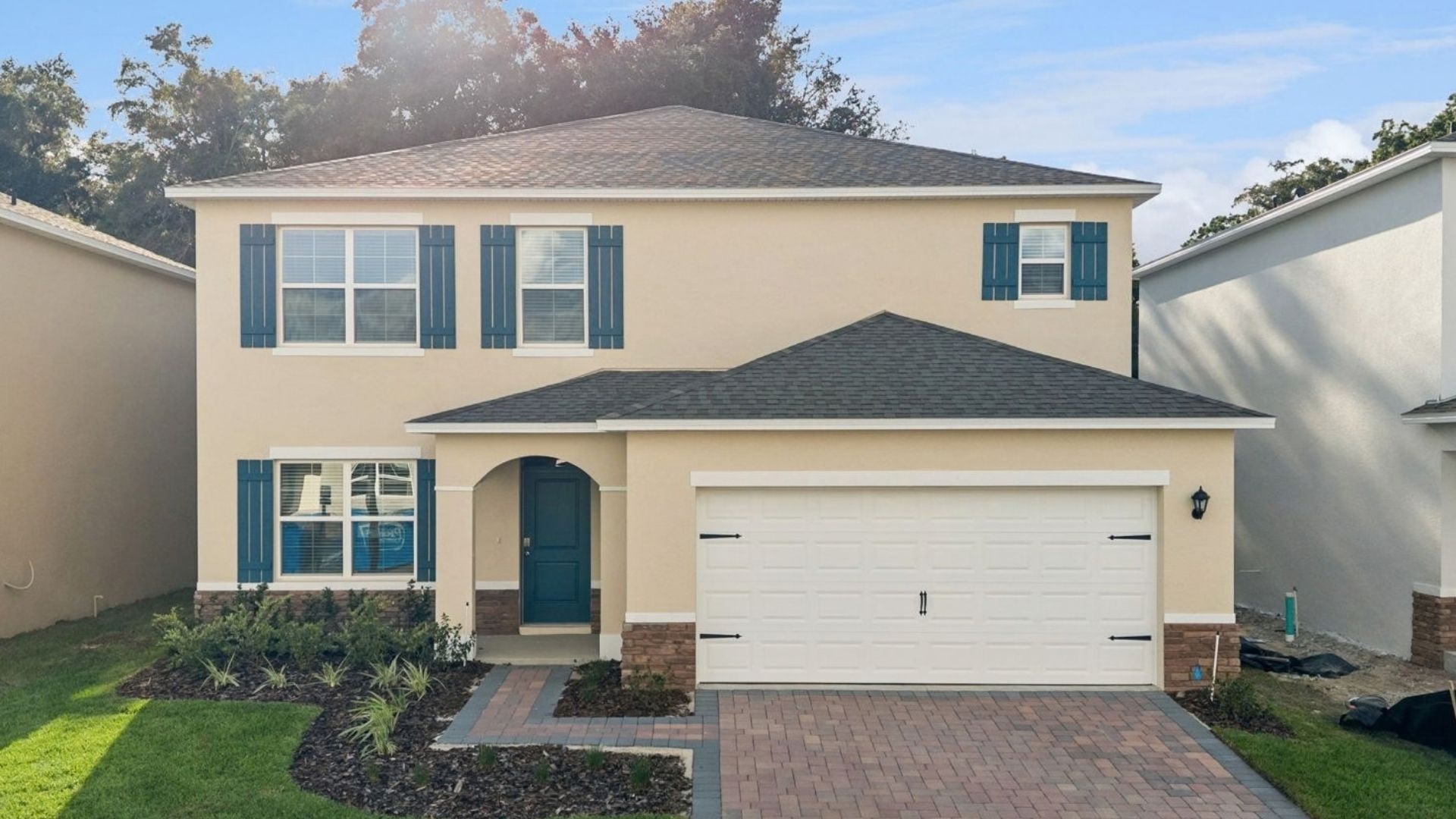 Two-story home with two car garage.