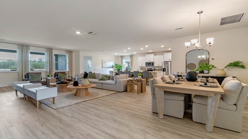 Kitchen with tall cabinetry, appliances, walk in pantry and Luxury vinyl plank flooring.