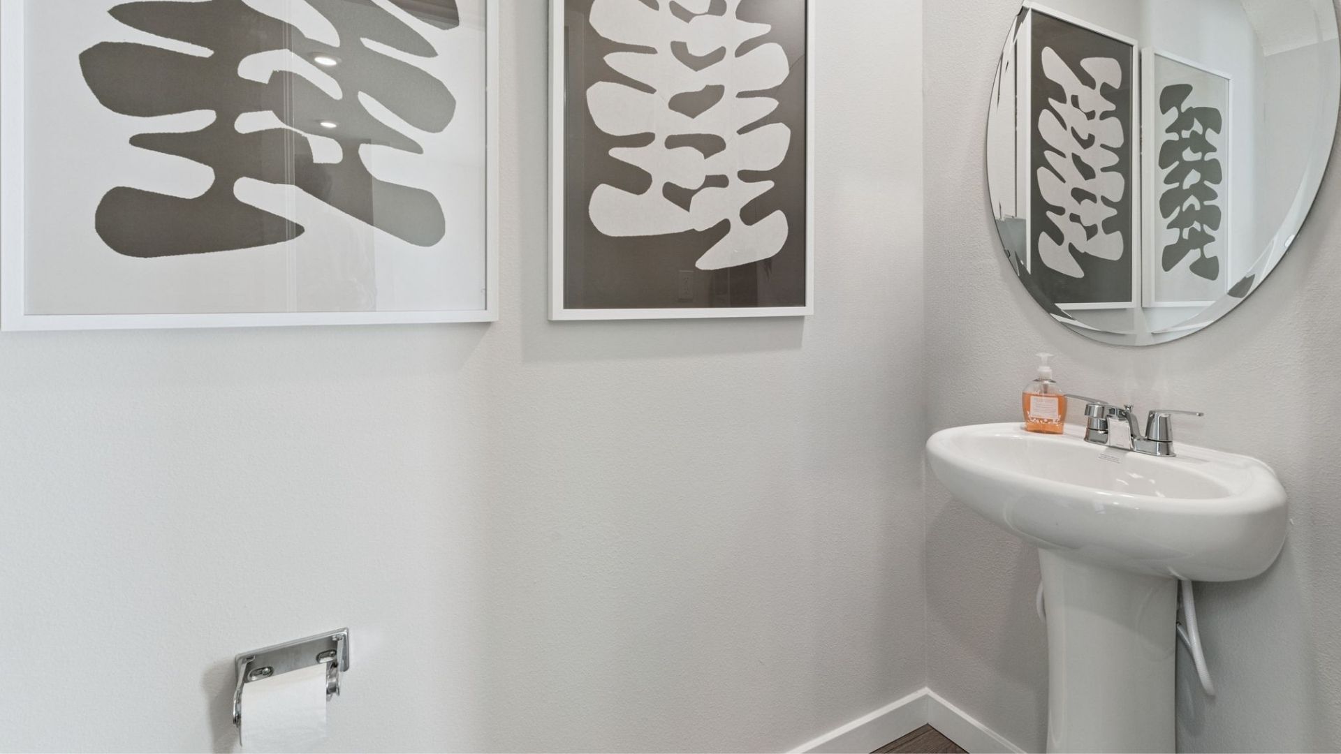 primary bathroom with quartz counters double sink and revwood select flooring
