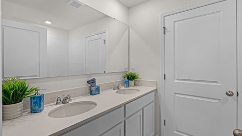 primary bathroom, quartz counters, revwood flooring