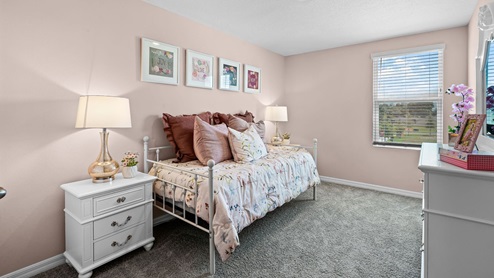 Guest bedroom, queen sized bed. carpet flooring