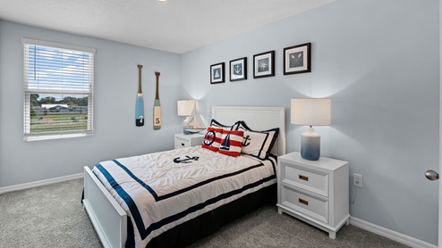 Guest bedroom, queen sized bed. carpet flooring