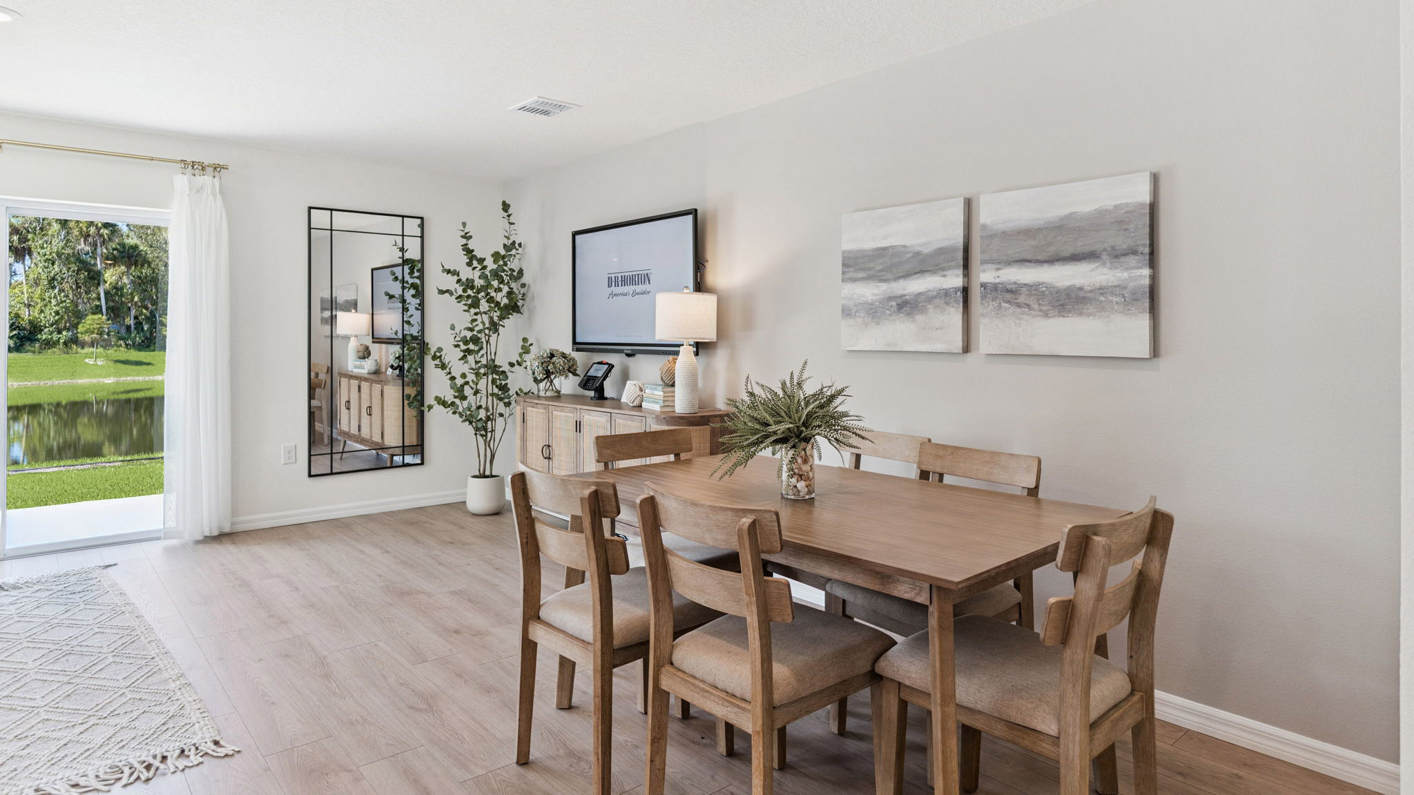 dining room table with seating overseeing living area