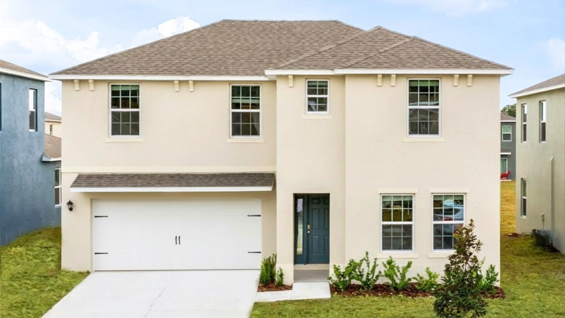 two story home with two car garage