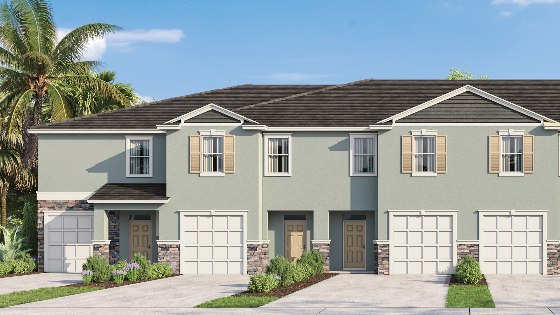.Attached townhome with concrete block and stone construction and a one-car garage.