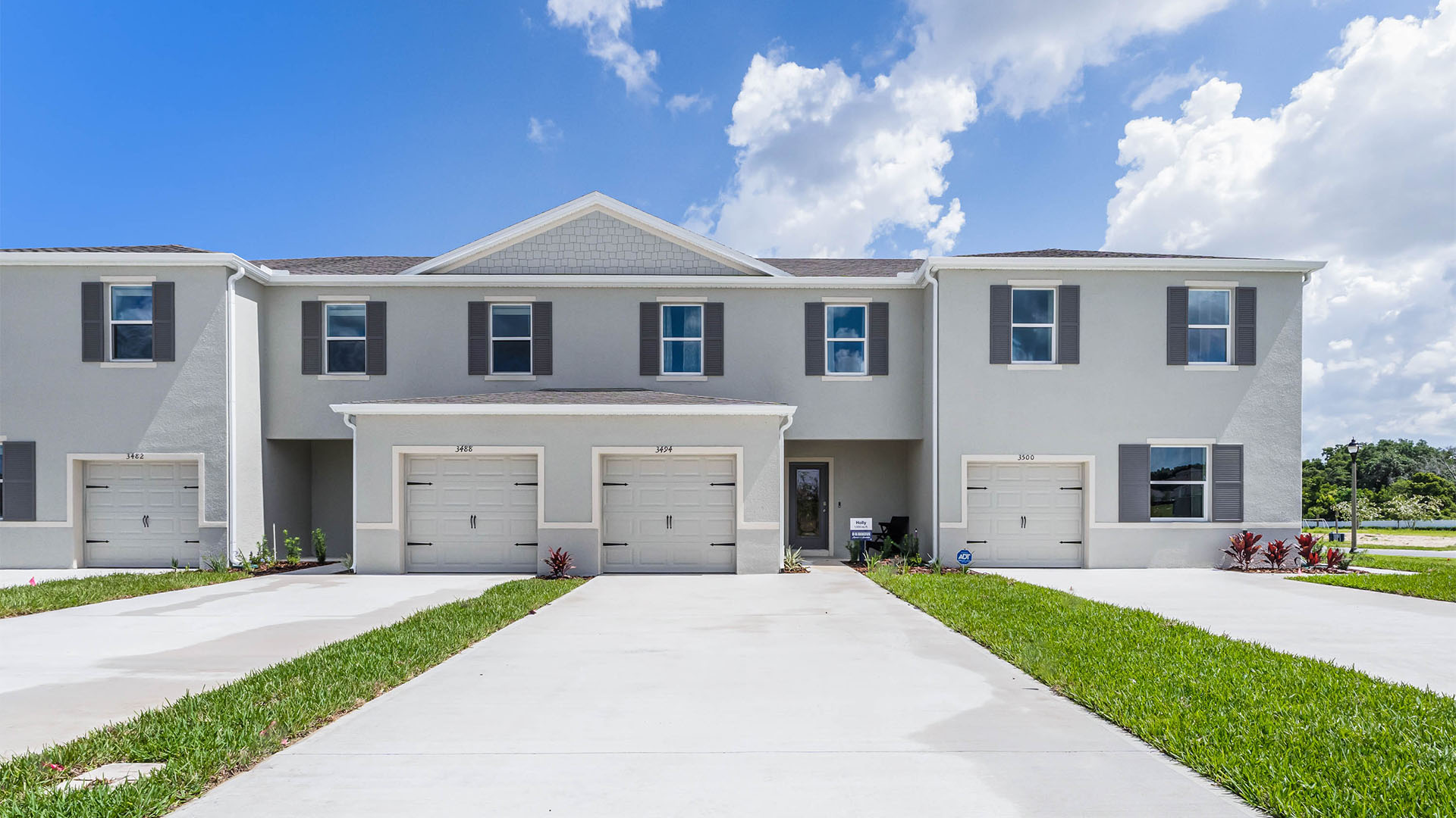 Attached townhome with concrete block construction and a one-car garage.