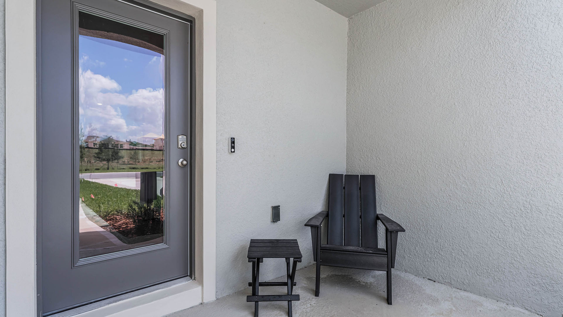 Outside entrance with porch seating.