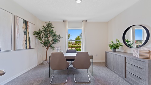Functional home office with desk, chairs and space to work or play.