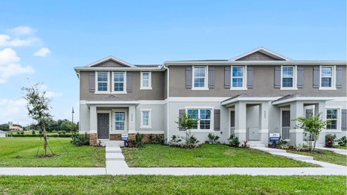 Attached townhome with concrete block construction.