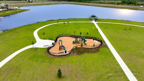 Kids outdoor playground with slide and swings.