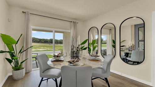 Dining room adjacent to the kitchen with table, chairs and tile flooring.