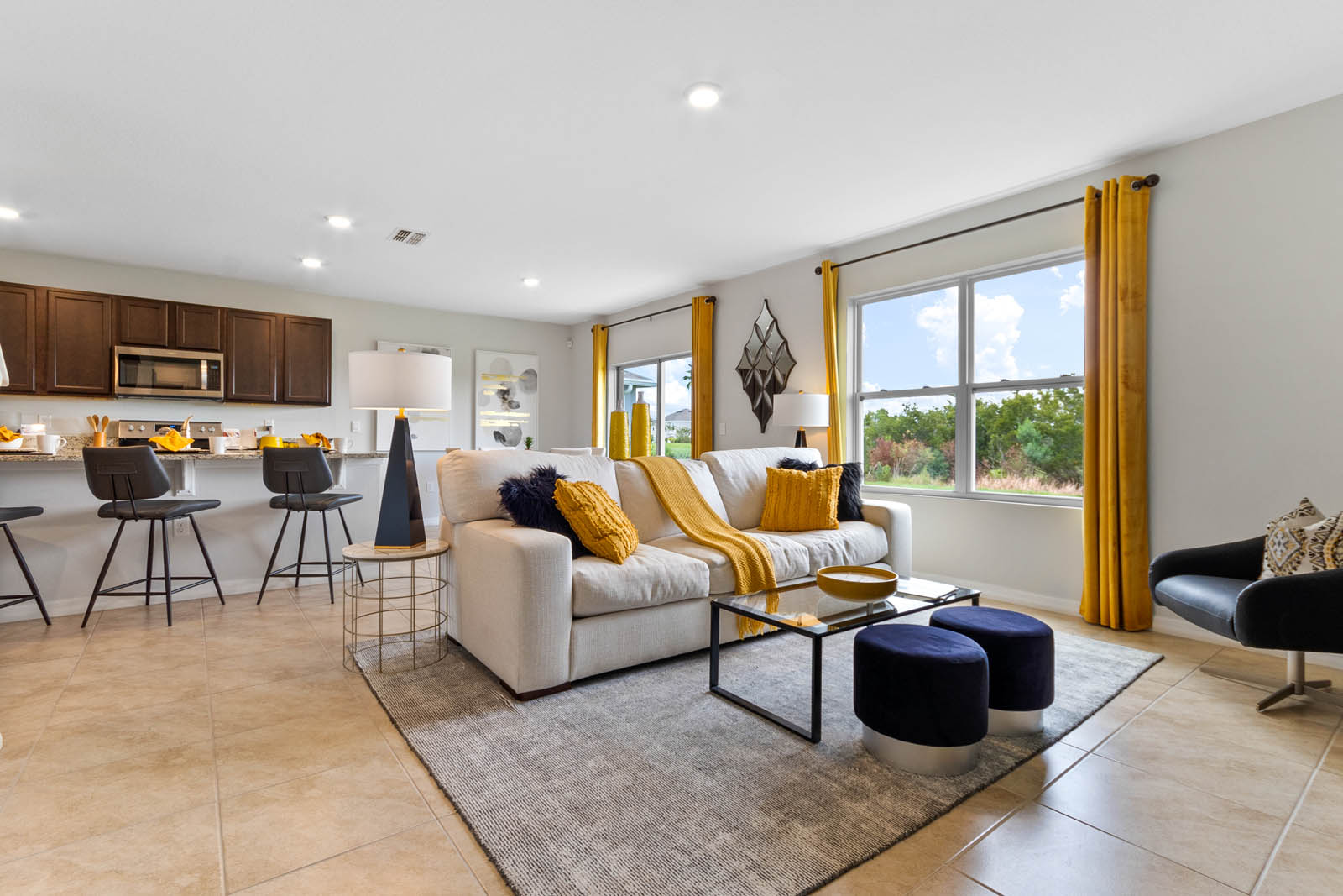Living room space with the kitchen behind