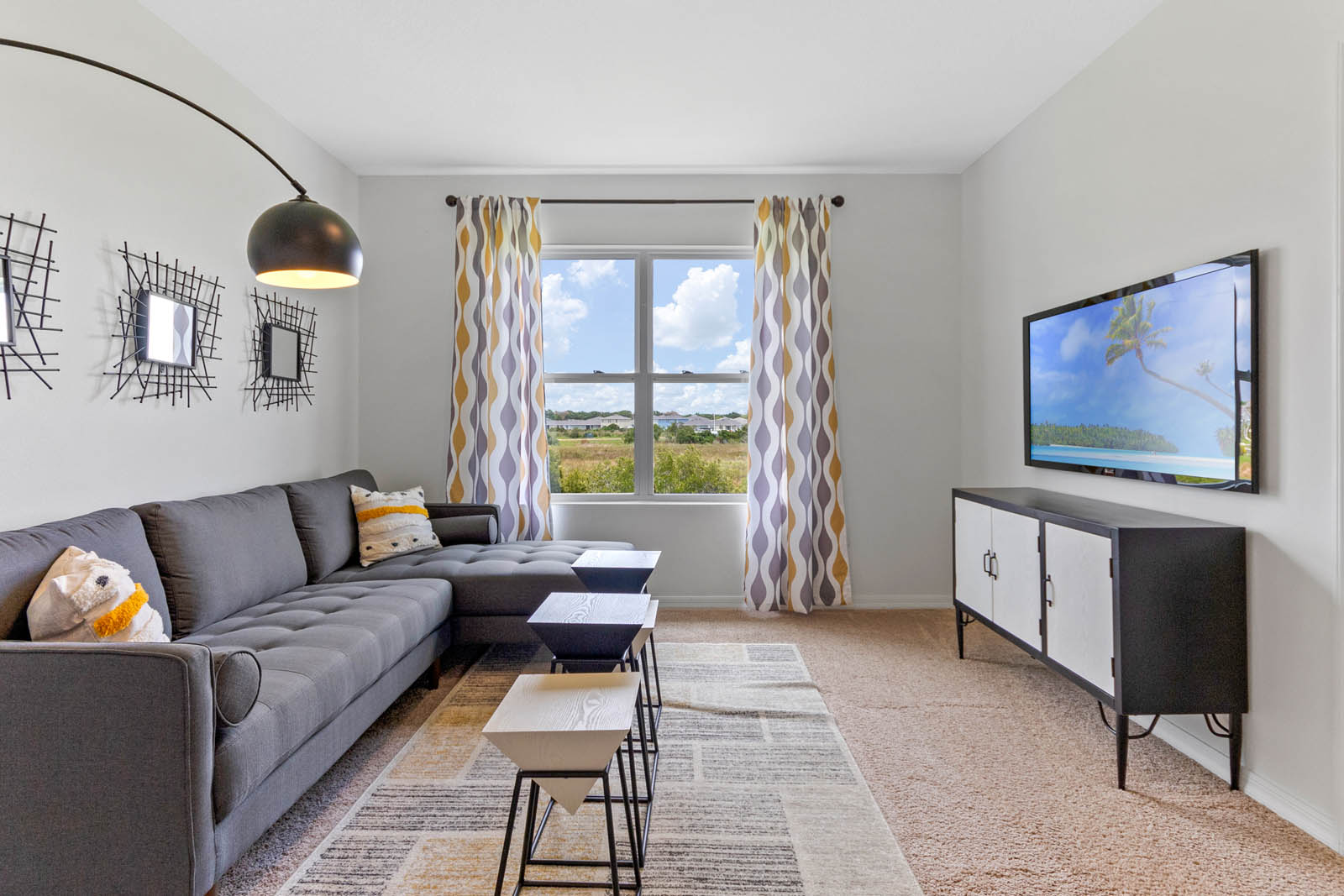 Upstairs loft area with couch and tv