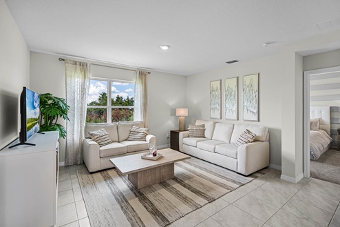 Living room area with tv and ceramic tile throughout