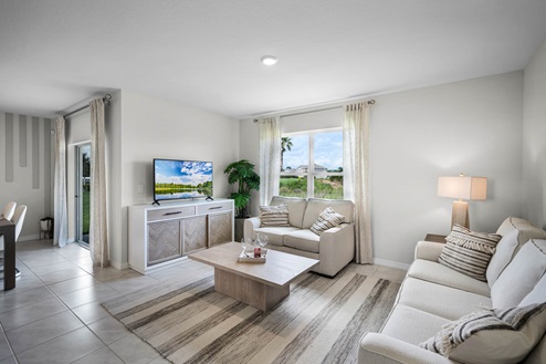Living room area with view of the kitchen
