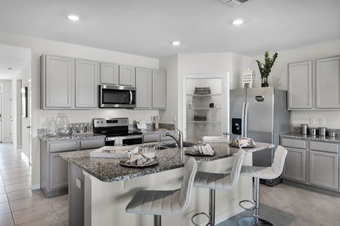 Kitchen island with pantry, stove and fridge