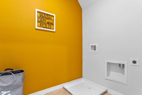 Laundry room with ceramic tile floors