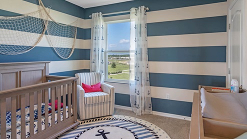 Guest room decorated as nautical nursery
