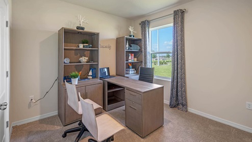 Office with desk and bookshelf