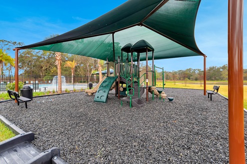 Playground with slides and covered awning