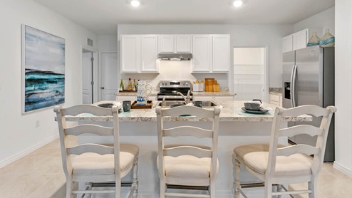 Kitchen with island with chairs