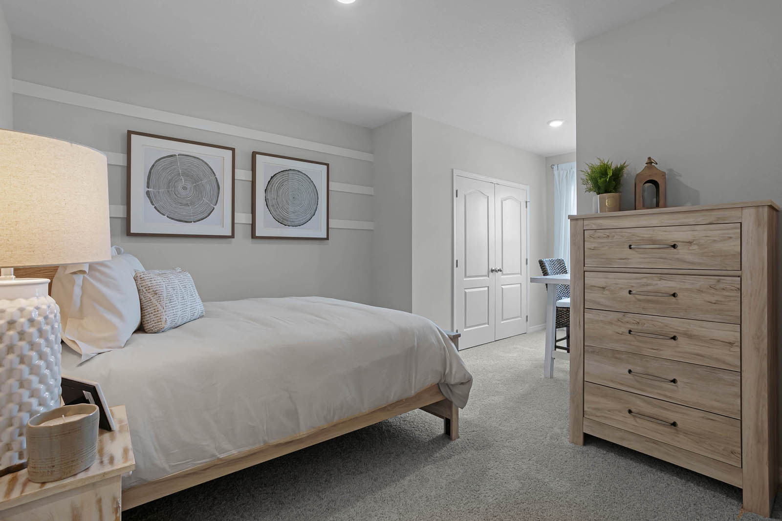 Guest room with full size bed and dresser