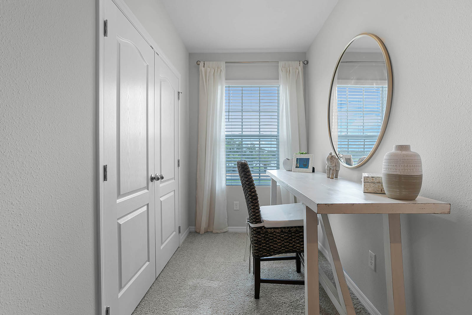 Guest room with closet and nook with desk