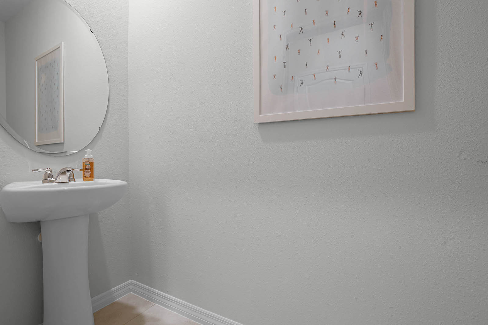 Downstairs half bathroom with toilet and sink