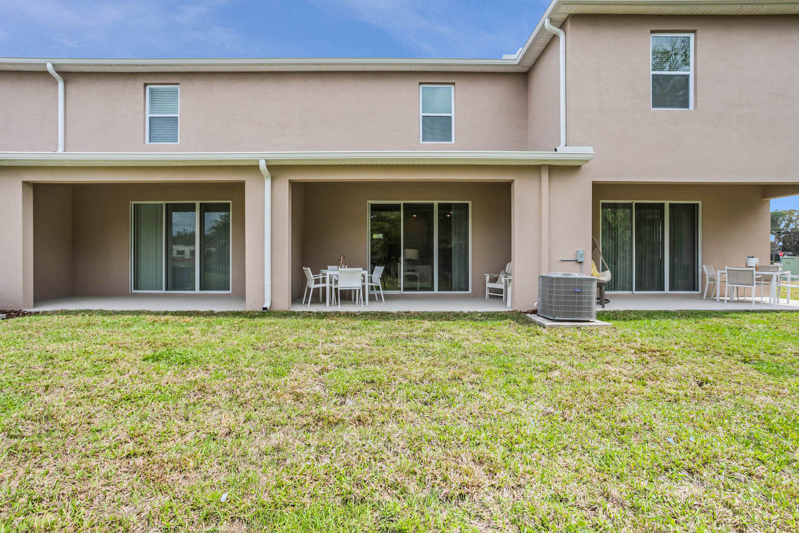 Rear covered lanai on two-story townhome