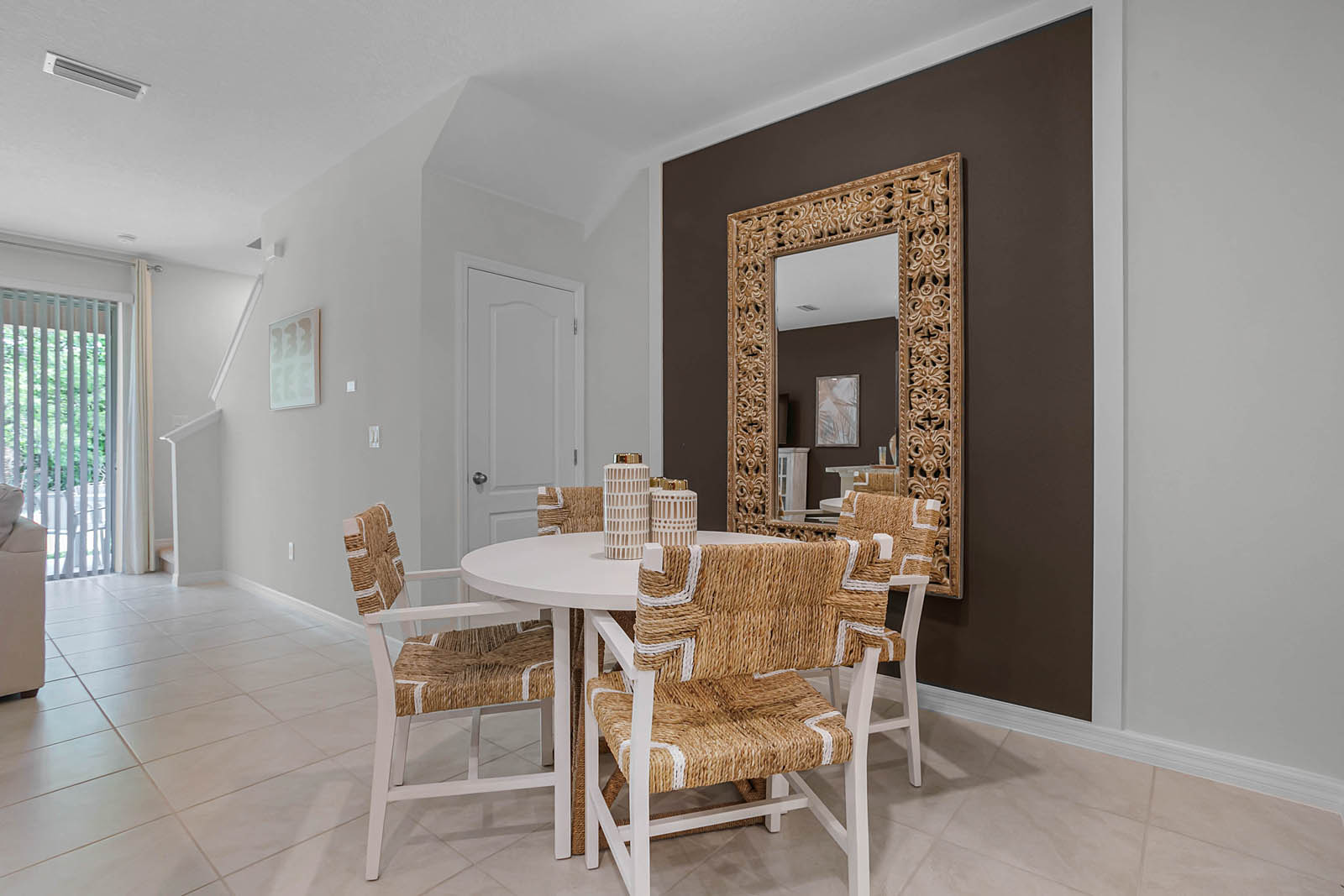 Dining room with 4 person table and mirror