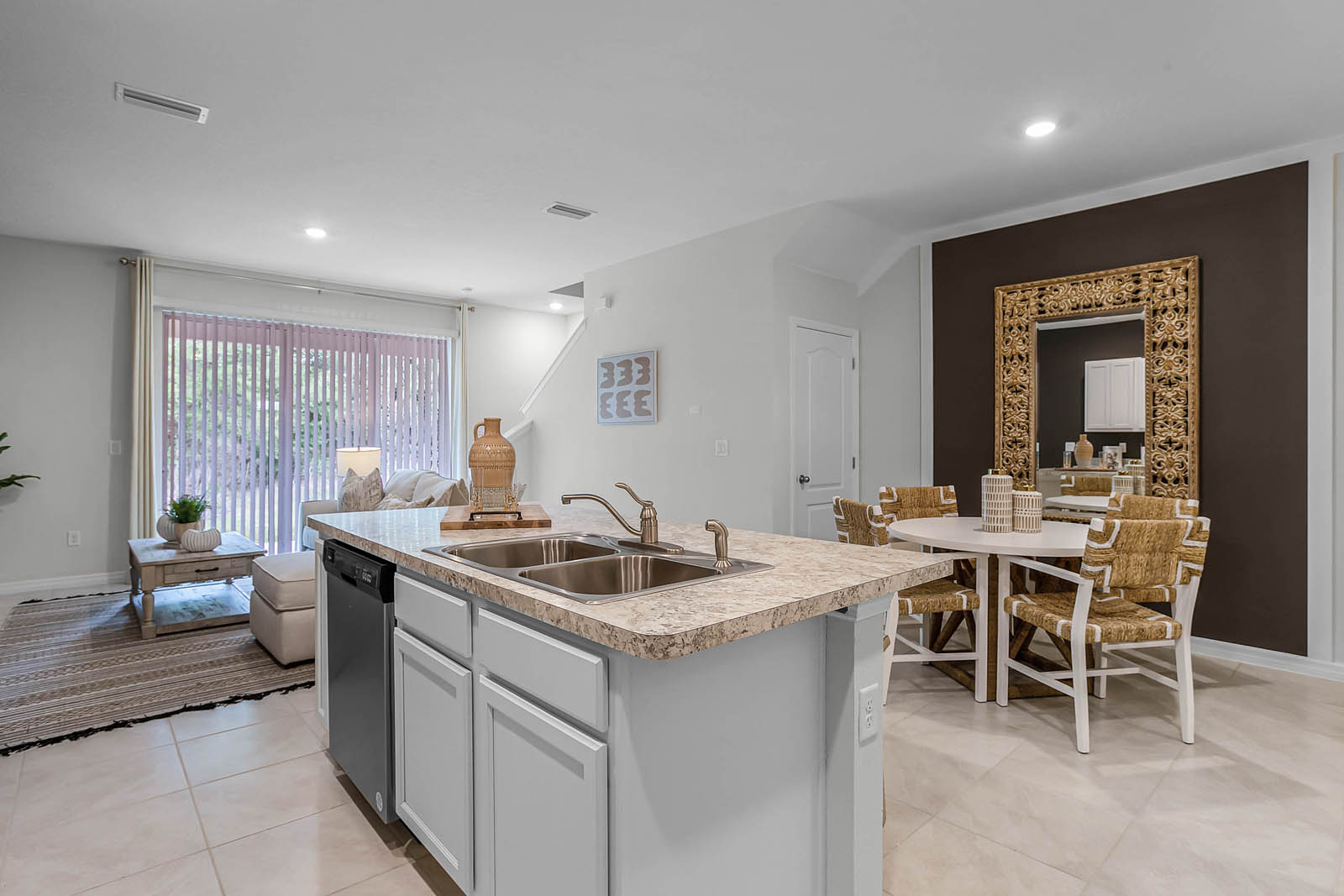 Kitchen island and dining room open to living room