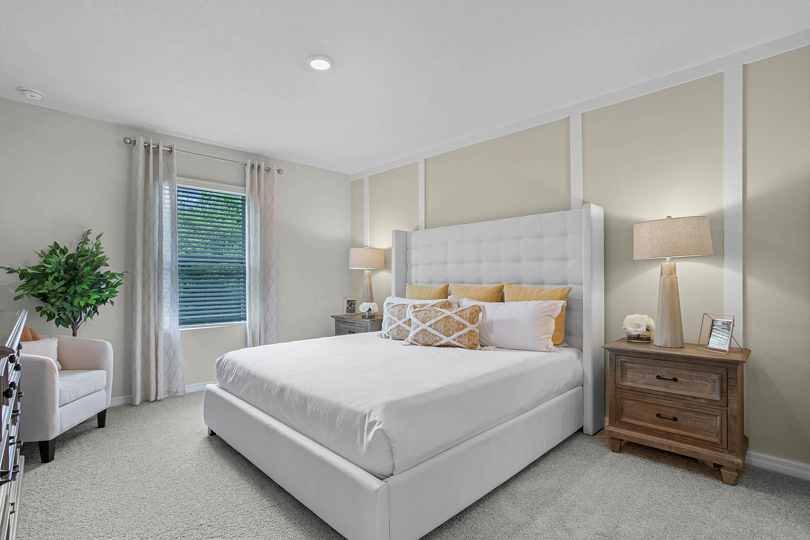 Primary bedroom with king size bed and attached primary bathroom