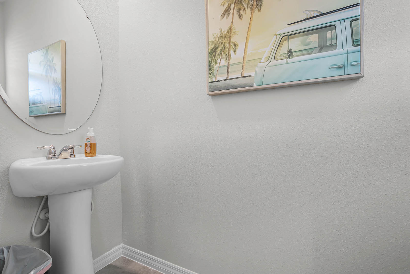 Downstairs half bathroom with sink and toilet
