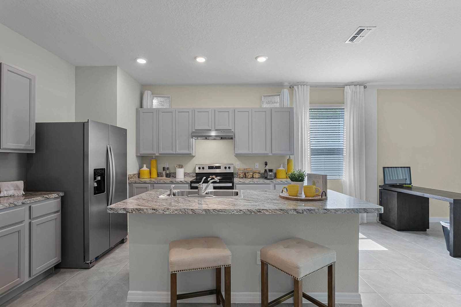 Spacious kitchen with island overlooking great room