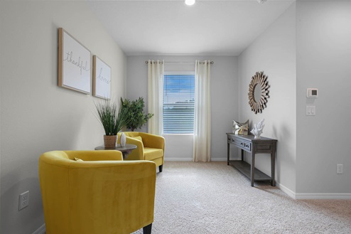 Upstairs flex space with seating and table