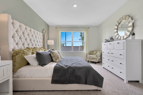 Primary bedroom with carpet throughout