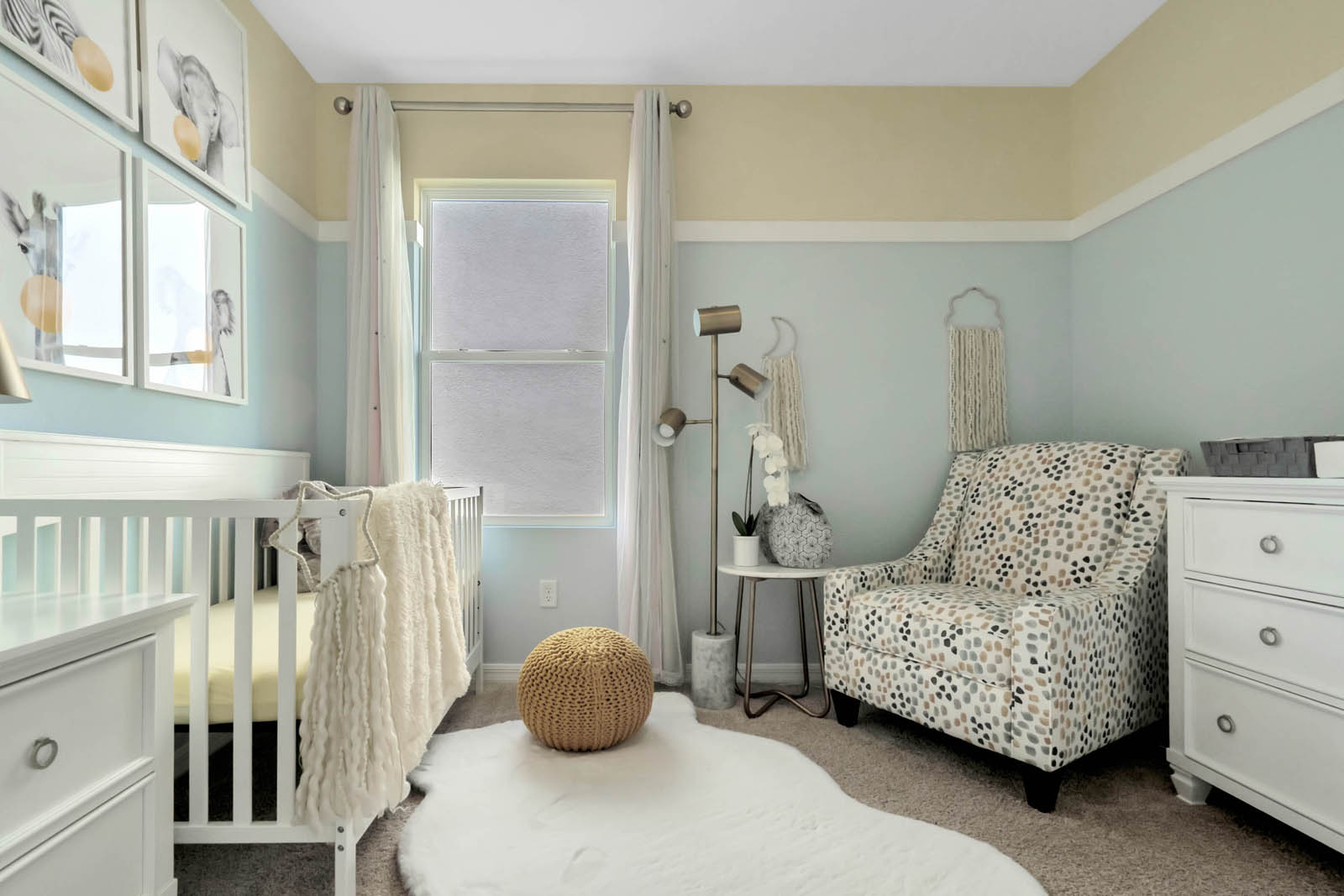 nursery with crib and chair