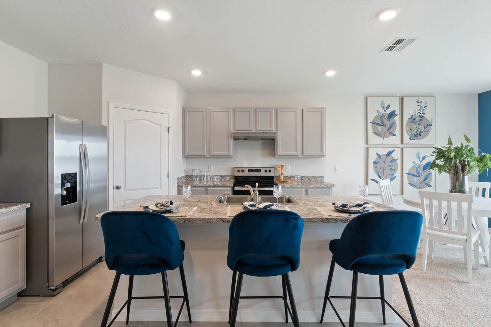 Kitchen with island and bar stools