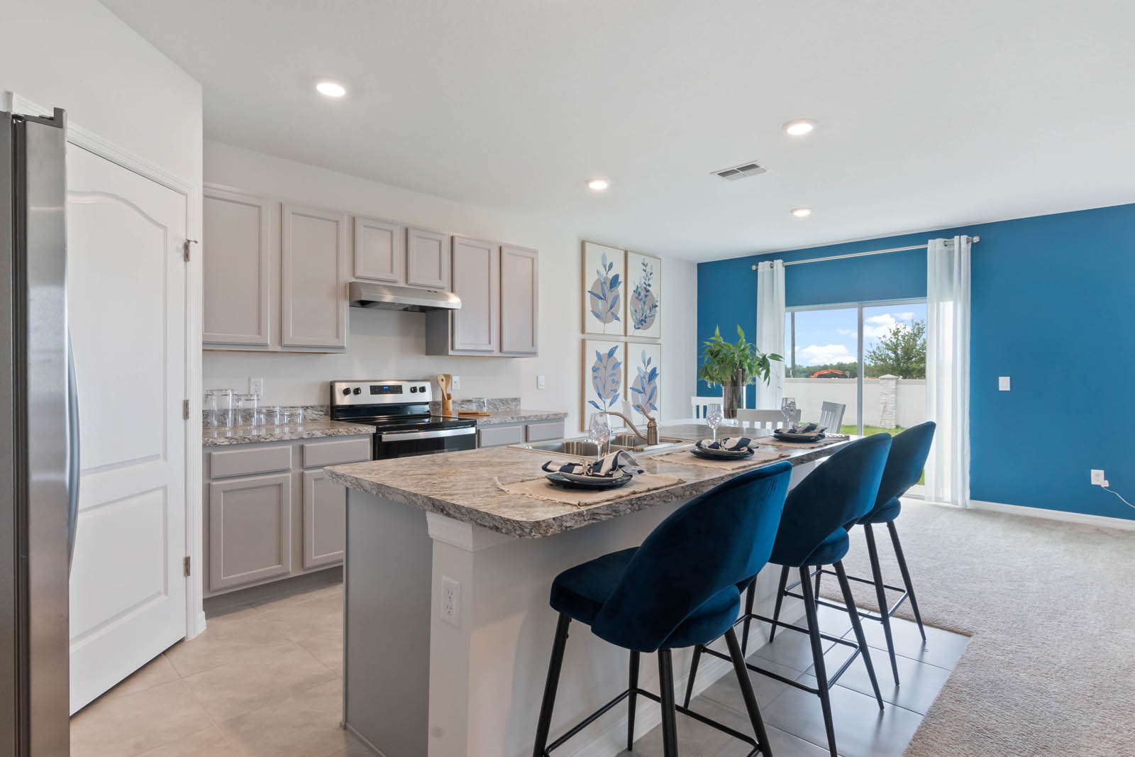Kitchen with eating space beige cabinets