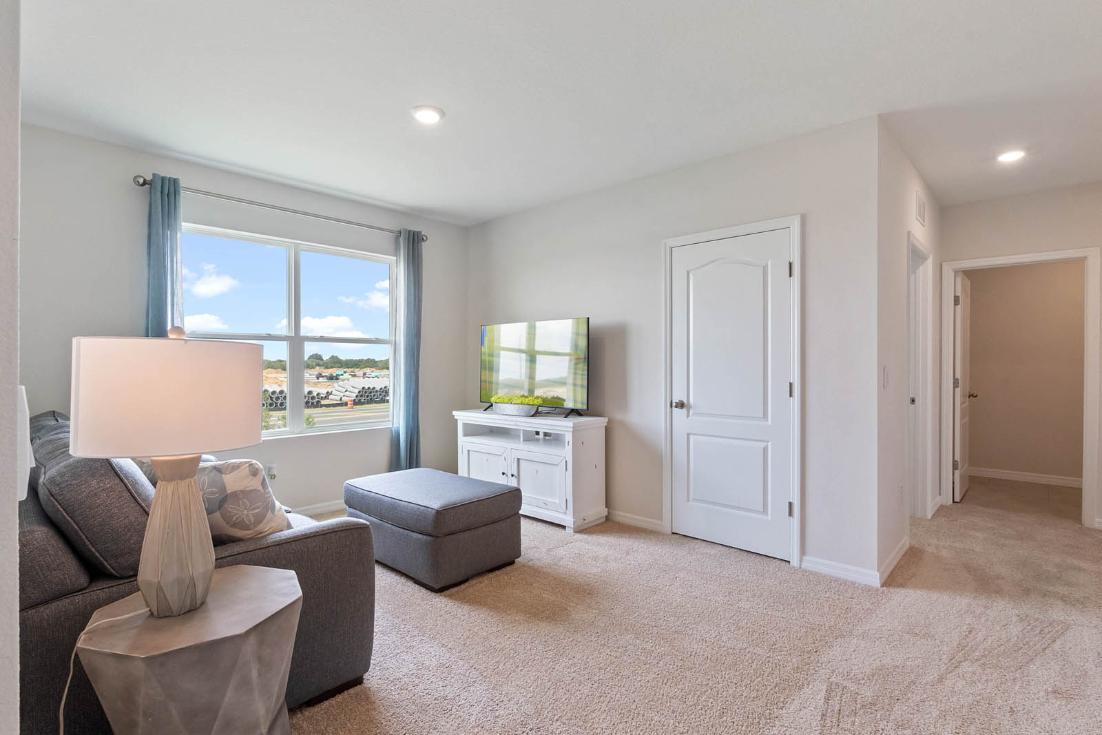 Upstairs loft space with window facing the yard