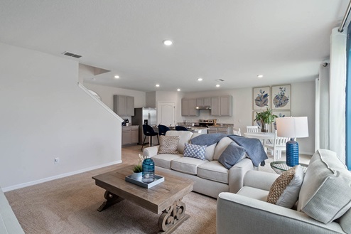 Living room and kitchen with the stairs to the side