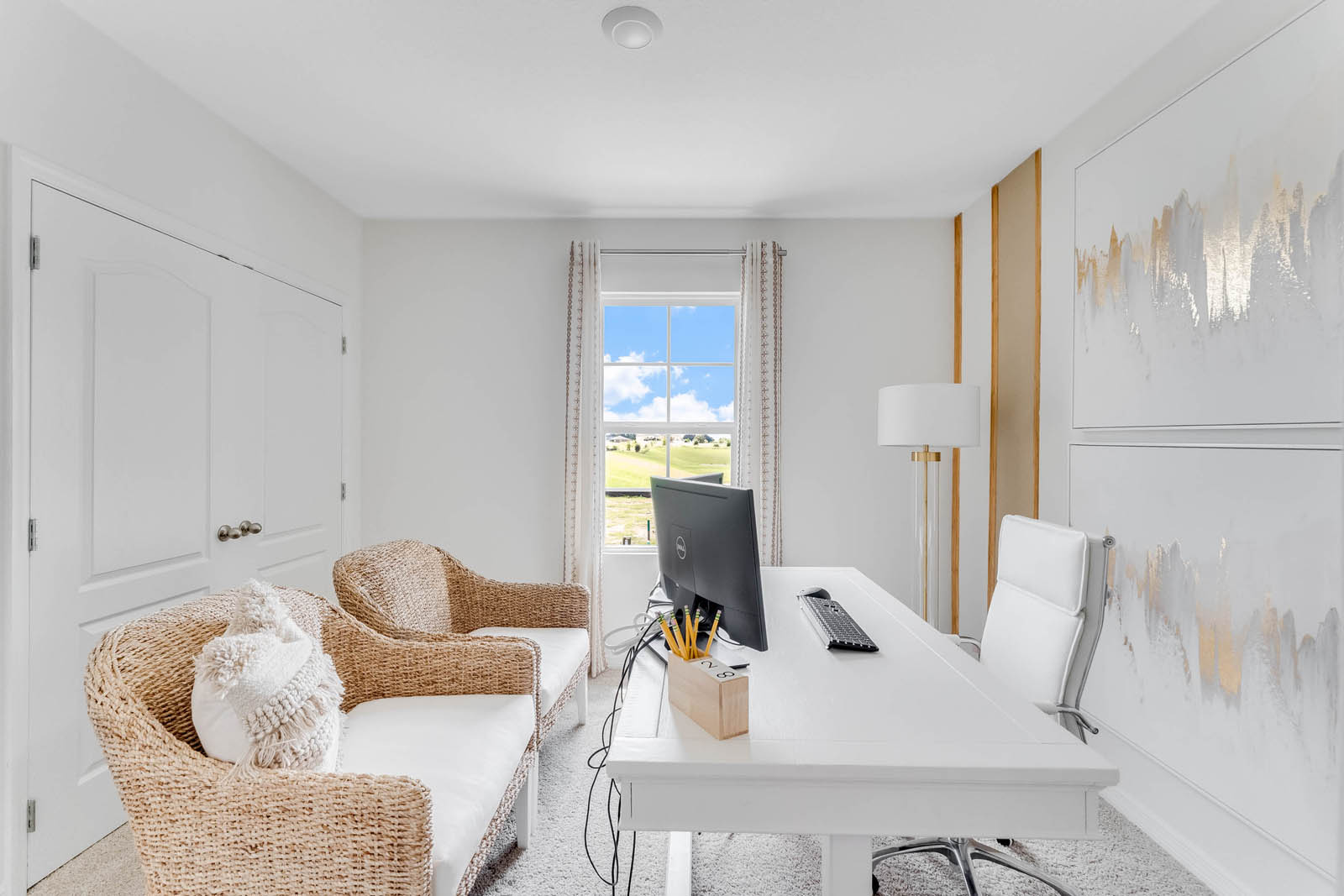 Upstairs guest room staged as office with desk and chairs