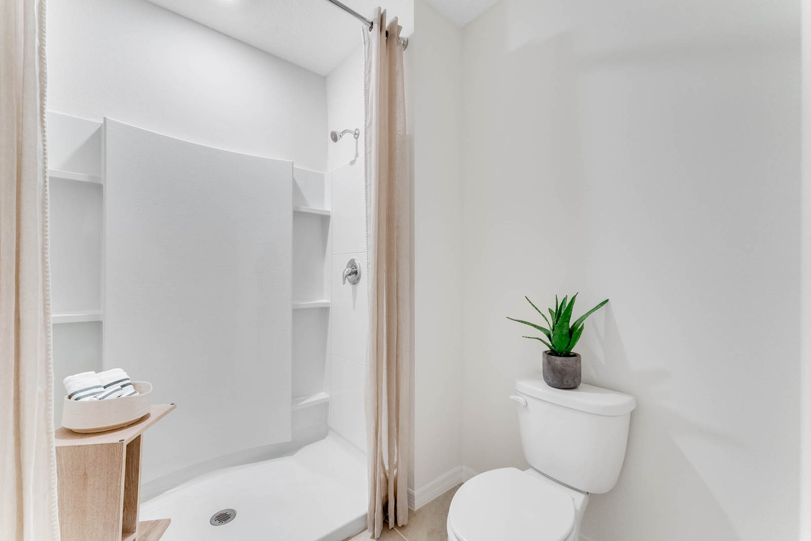 Primary bathroom with walk in shower and toilet