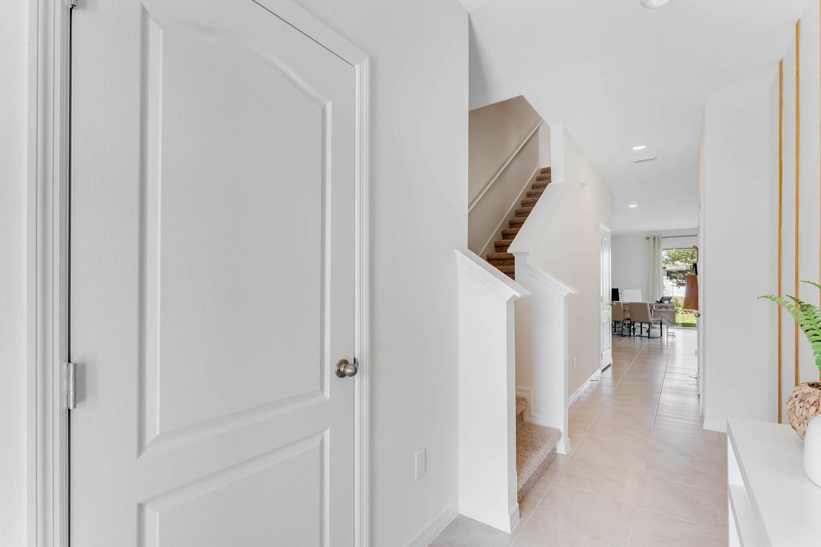 Entryway with access to the stairs and hallway