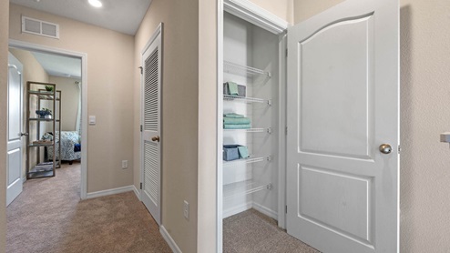 Upstairs Hallway showing linen closet near guest bedrooms