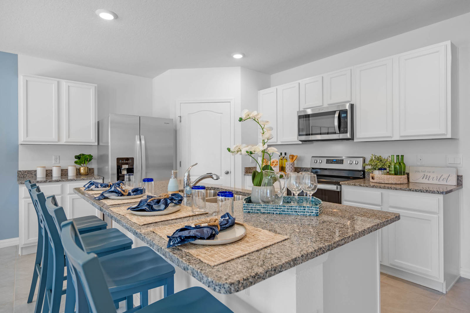 Kitchen counter with barstools and island